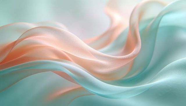 Flowing sheer silk ribbons forming pastel peach and seafoam waves in soft bokeh