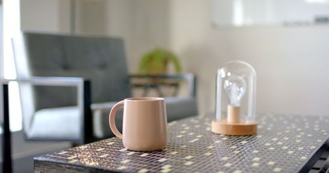 Contemporary workspace with mug and creative decor