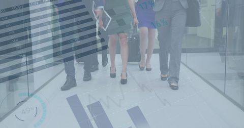 Businesspeople Walking Amidst Digital Charts and Graphs