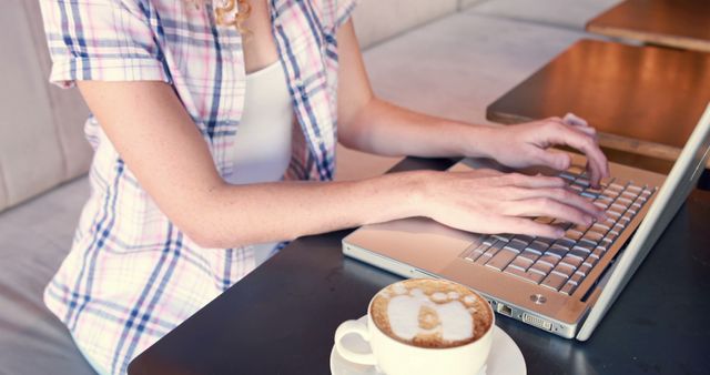 Woman Typing on Laptop with Coffee in Modern Café - Download Free Stock Images Pikwizard.com