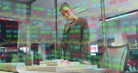 Caucasian Businesswoman Analyzing Stock Market Data in Modern Office