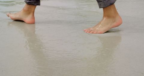 Barefoot Walk on Sandy Beach with Gentle Sea Waves - Download Free Stock Images Pikwizard.com