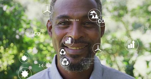 Man monitoring environmental data on futuristic interface