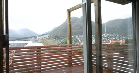 Wet Wooden Balcony Overlooking Misty Mountain Landscape