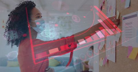 Business Professional Analyzing Data with Pandemic Safety Measures