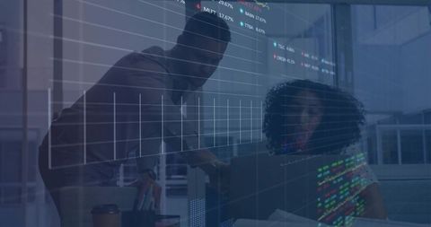 Business Team Collaborating Over Laptop With Financial Charts and Digital Data Overlay