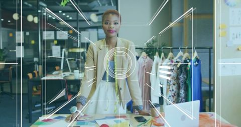 Female designer organizing patterns in creative fashion studio