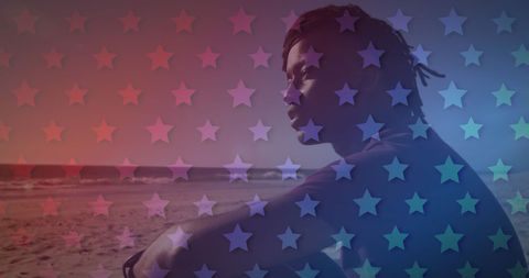 Reflective Moment on Beach with Overlay of American Stars