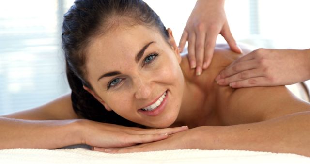 Smiling Woman Enjoying Relaxing Shoulder Massage - Download Free Stock Images Pikwizard.com