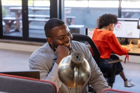 Smiling Business Professional Working in Modern Office