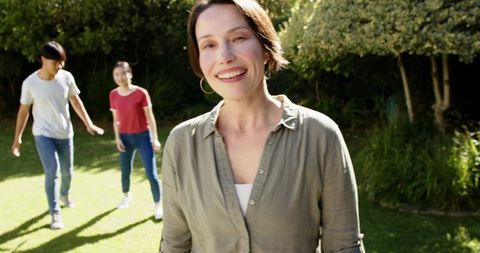 Mother Enjoying Family Time in Sunny Garden