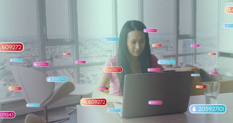 Asian Woman in Modern Office with Digital Data Interface