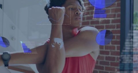 Male athlete stretching with augmented reality fitness charts and smartwatch tracking