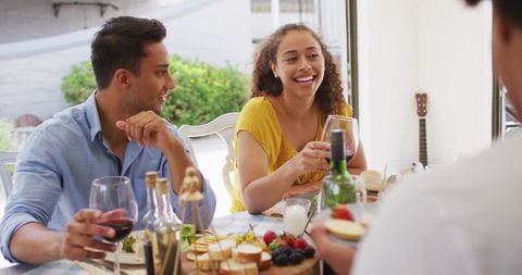 Friends Enjoying Drinks and Conversation at Outdoor Gathering