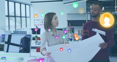 Architects Collaborating Over Blueprint with Digital Overlays