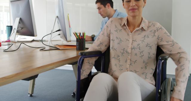 Office Professional Woman Using Wheelchair Working in Comfortable Workspace - Download Free Stock Images Pikwizard.com