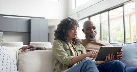 Couple Enjoying Tablet Together in Modern Living Space - Download Free Stock Images Pikwizard.com