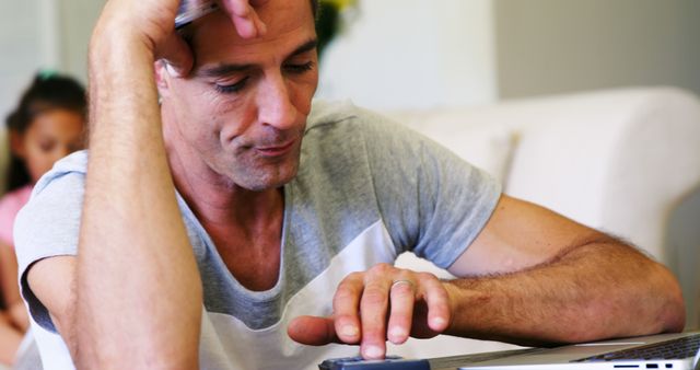 Focused Man Contemplating While Using Tablet at Home - Download Free Stock Images Pikwizard.com