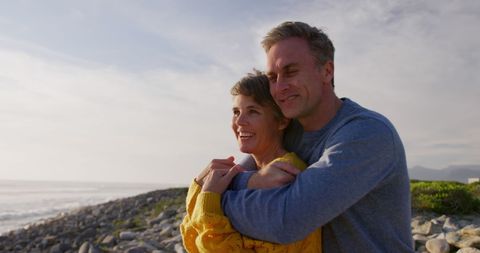 Happy Senior Couple Embracing on Beach During Sunset - Download Free Stock Images Pikwizard.com