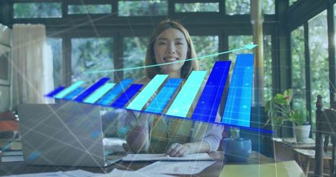 Businesswoman Analyzing Holographic Growth Chart at Workspace