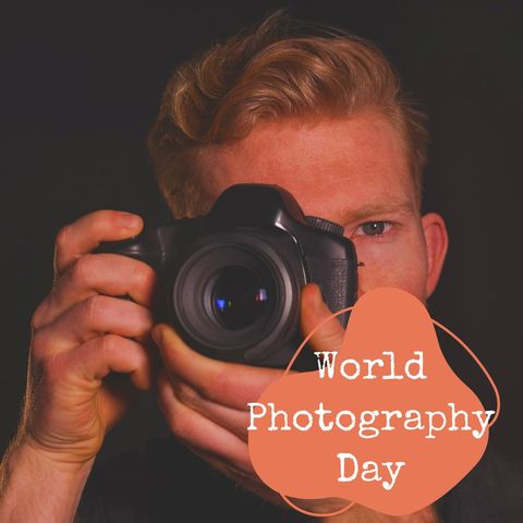 man celebrating world photography day with camera - Download Free Stock Templates Pikwizard.com