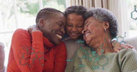 Multigenerational family hugging on couch smiling in sunlit living room with teal overlay