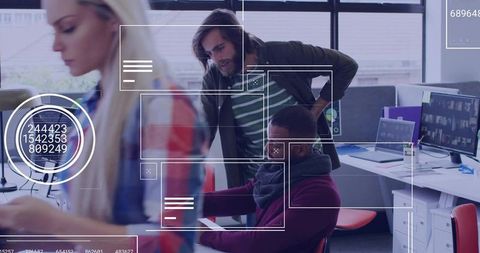 Team Analyzing Data with Interactive Technology in Modern Office