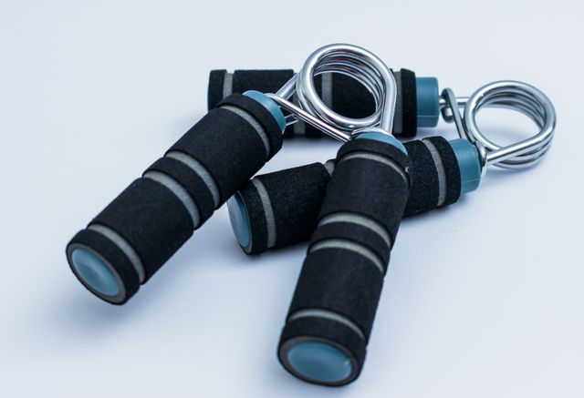 Hand grippers are essential for strength training and muscle building, focusing on hand and wrist strength. These fitness tools are black and silver and are great for gym workouts, physical therapy, and improving grip. Perfect for athletes, fitness enthusiasts, or those looking to enhance hand strength recovery.