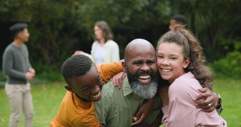 Joyful Multigenerational Family Bonding in Lush Backyard