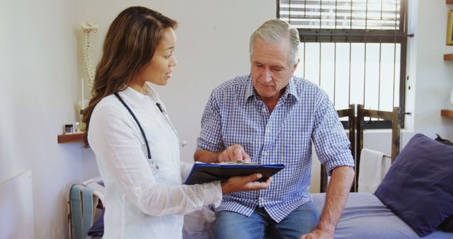 Doctor Discussing Diagnosis with Senior Patient in Clinic - Download Free Stock Images Pikwizard.com