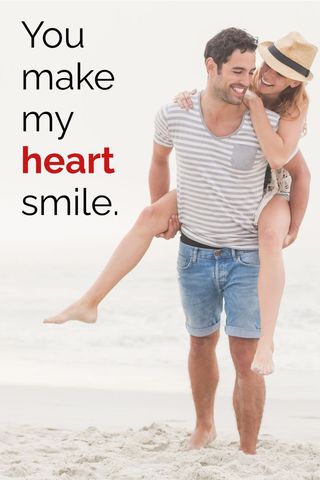 Joyful couple embracing romance on sunny beach