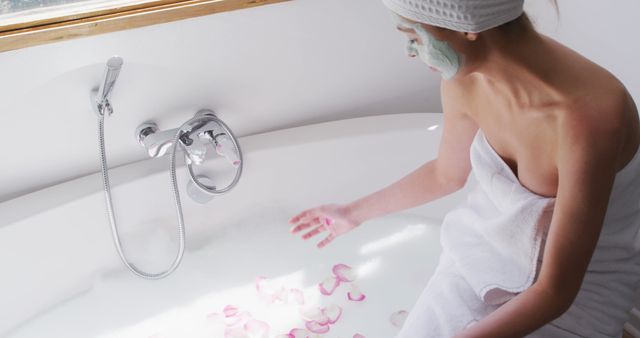 Woman Relaxing in Bathtub with Rose Petals and Face Mask - Download Free Stock Images Pikwizard.com