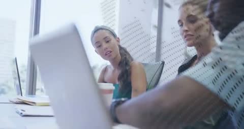 Team Analyzing Data and Collaborating in Modern Office Meeting