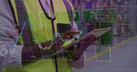 Warehouse supervisor analyzing data on tablet with digital chart overlays