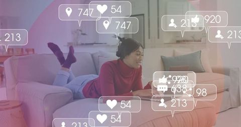 Woman Engaging with Social Media on Sofa in Cozy Living Room