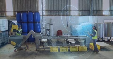 Factory Workers Managing Automated Conveyor with Tablets