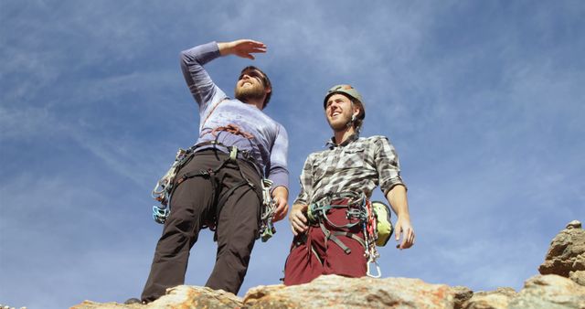 Two Rock Climbers Preparing for Ascent with Safety Gear on Sunny Day - Download Free Stock Images Pikwizard.com