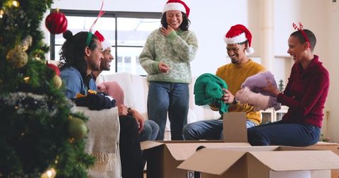 Friends Exchanging Gifts by Christmas Tree, Festive and Cozy Gathering