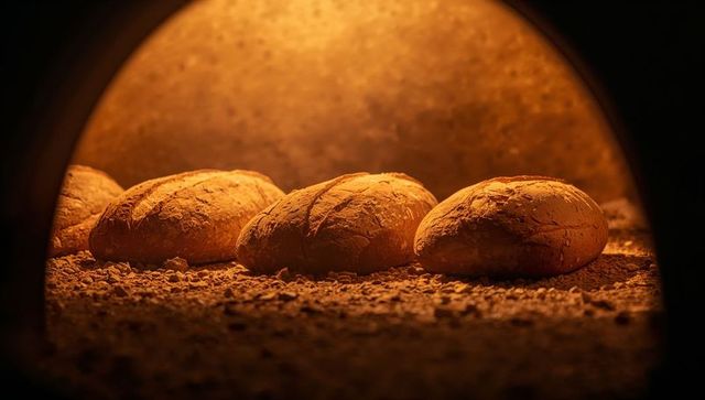 Artisan bread baking in traditional stone oven for a rustic feel