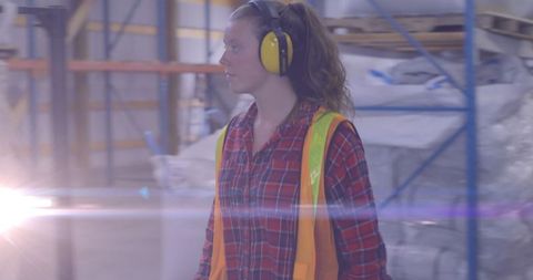 Female Warehouse Worker with Protective Gear in Safety Environment - Download Free Stock Images Pikwizard.com