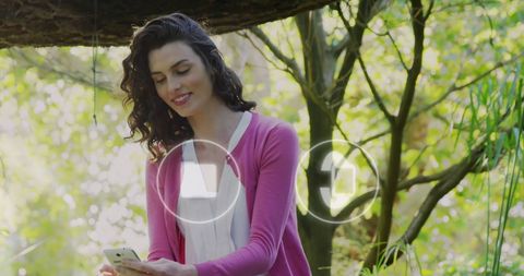 Woman Engaging on Social Media with Smartphone in Nature