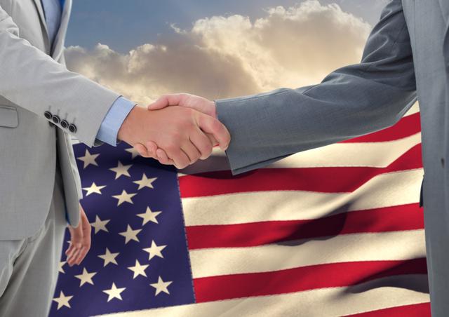 Business executives shaking hands with American flag in background, signifying partnership, collaboration, and agreement within American context. Suitable for themes of patriotism, business deals in the USA, cooperation among US businesses, and teamwork. Ideal for corporate presentations, articles on business relations in the United States, and marketing materials highlighting American partnerships.