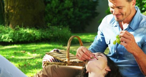 Romantic Picnic Couple Enjoying Outdoors on Sunny Day