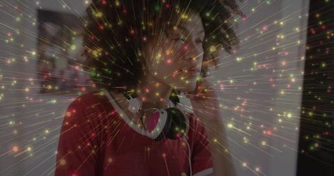 Young Woman Immersed in Vibrant Music Experience with Dynamic Particles