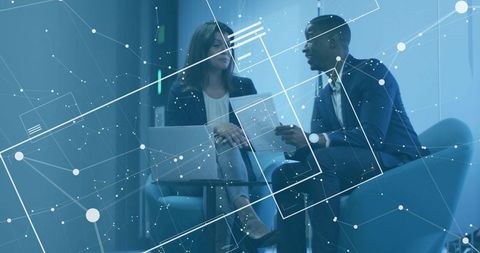 Executives Collaborating in Modern Office Lounge with Digital Network Overlay and Laptop