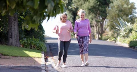 Middle-aged and Senior Women Walking in Nature for Fitness