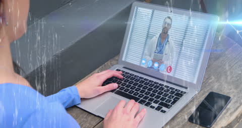 Woman Engaging in a Video Call on Laptop with Digital Overlay
