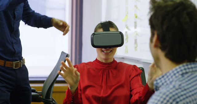 Woman Wearing VR Headset in Office Having Fun with Colleagues - Download Free Stock Images Pikwizard.com
