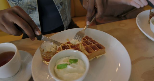 Person Having Breakfast with Waffles, Syrup, and Whipped Cream - Download Free Stock Images Pikwizard.com