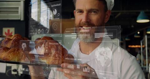 Baker Holding Freshly Baked Bread with Digital Data Overlays